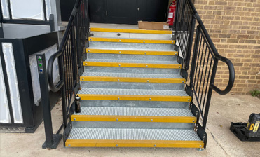 DDA step system with handrail